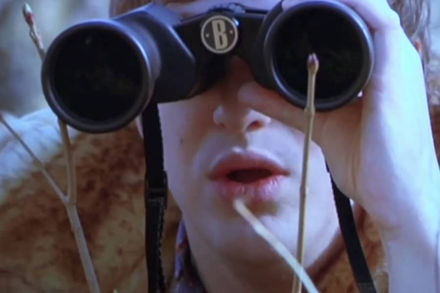 Matt looking through binoculars
