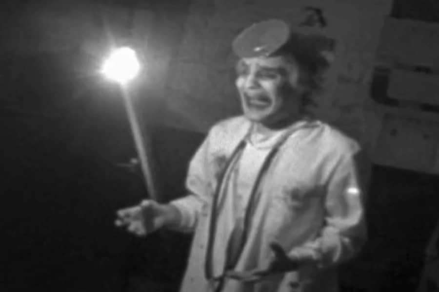 the doctor looks upset as a light bulb swings back and forth