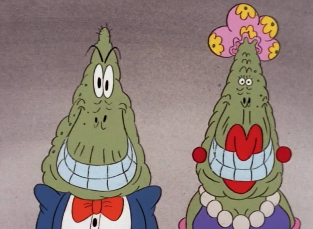 cartoon characters the Fatheads, a lumpy man and woman both with huge, off-putting smiles