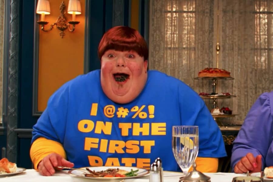 Portnoy as a redhead boy wearing a shirt that says “I @#%! on the first date”
