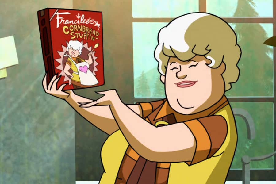 Francilee holding up a box of her cornbread stuffing