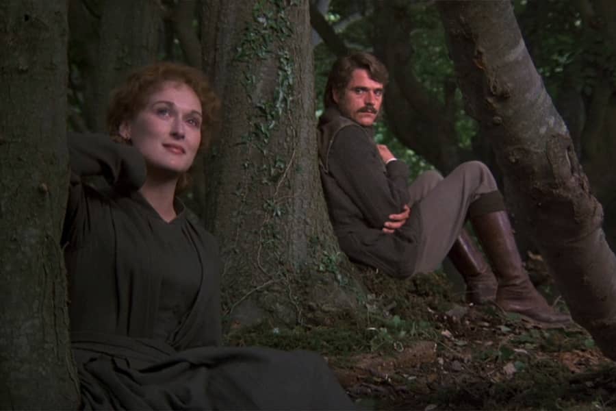 Sarah and Charles sit in the forest and talk