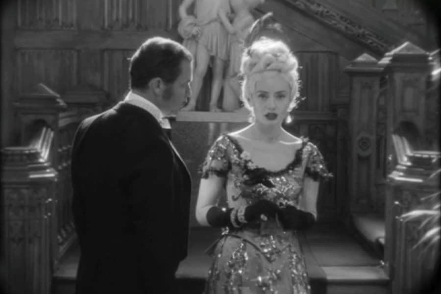 Bill speaks with Lady Anne near some stairs