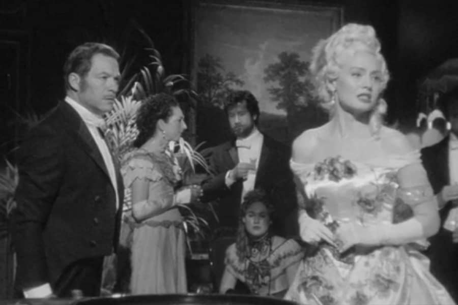 Bill looks at Lady Anne as she looks away, upset