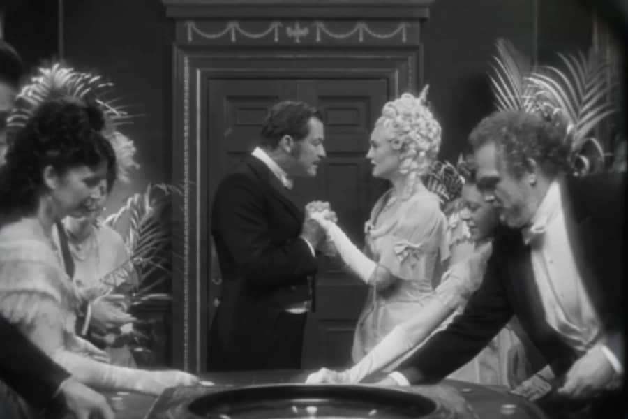 Bill and Lady Anne hold hands and speak closely