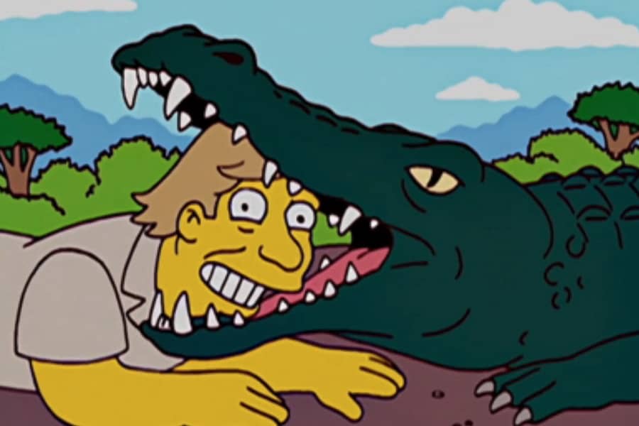 Gator Baiter with his head in a gator’s mouth