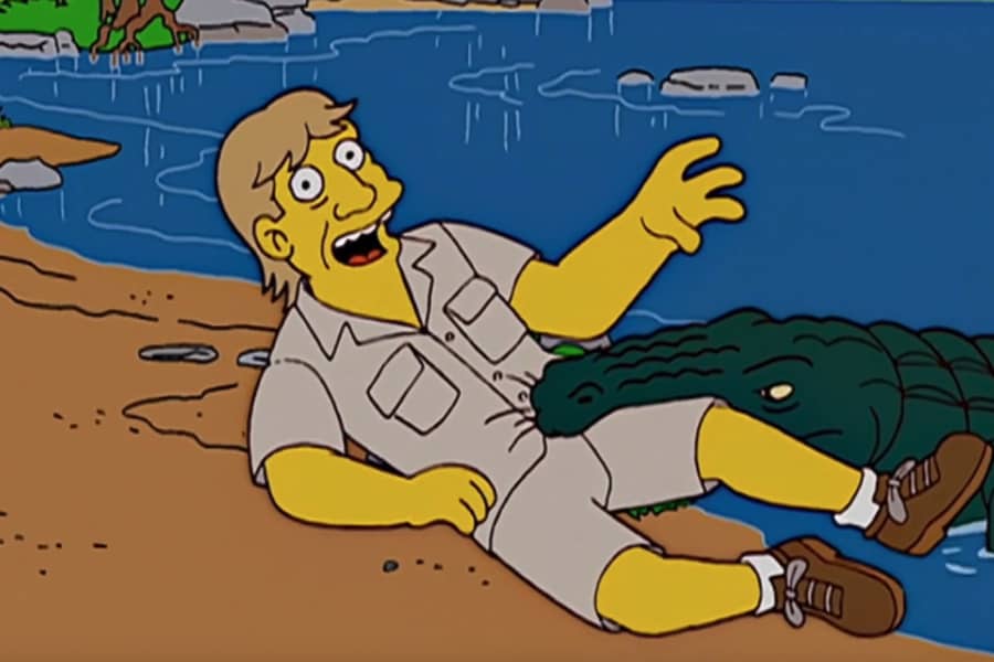 Gator Baiter talking while the gator is biting his torso