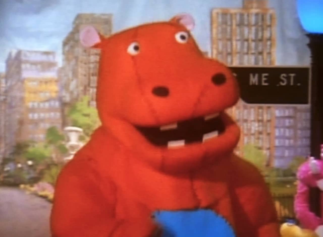 Georgie, a red dinosaur character