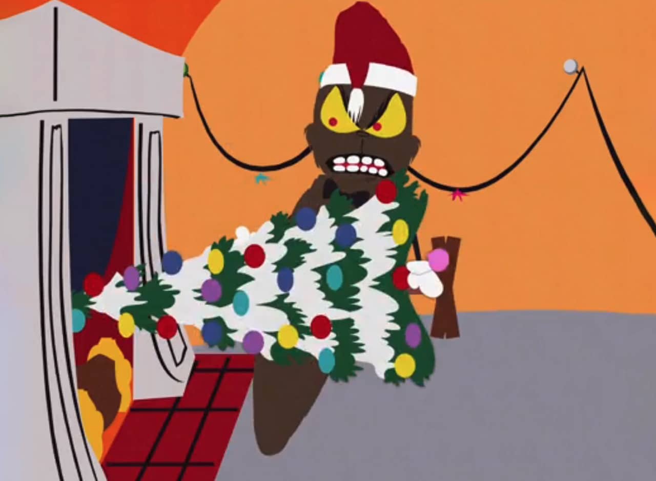Grinchy Poo trying to get a Christmas tree up the chimney