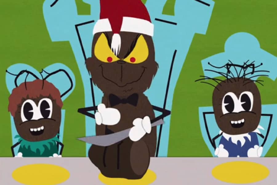 Grinchy Poo cutting a Christmas roast next to two kid Poos