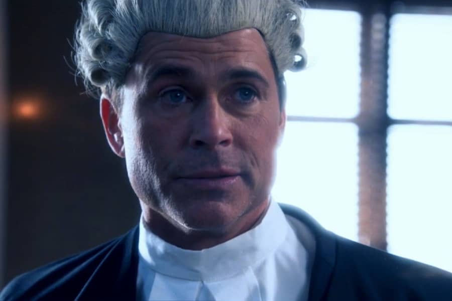 Grinder wearing a barrister’s robe and wig