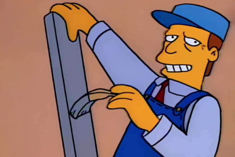 McClure painting a board