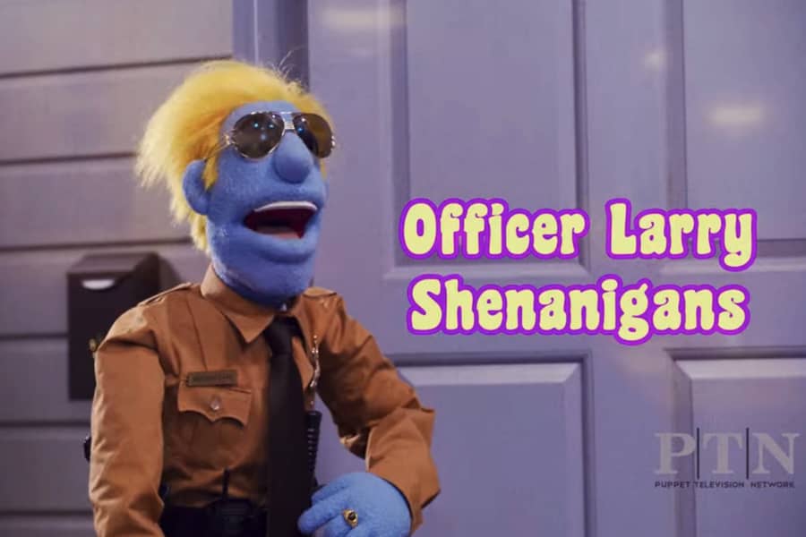 Officer Larry Shenanigans, a blue puppet cop