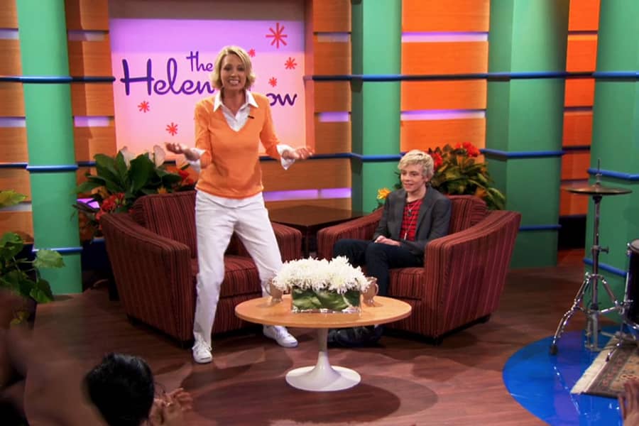 Helen dancing while Austin Moon sits awkwardly