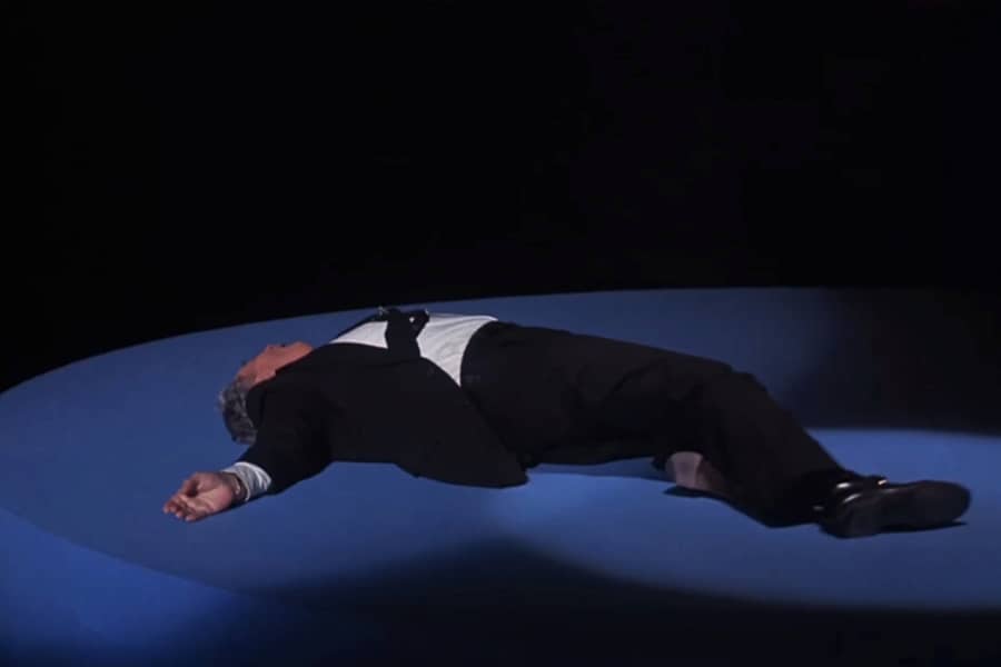 Howard Beale pretending to be dead on stage