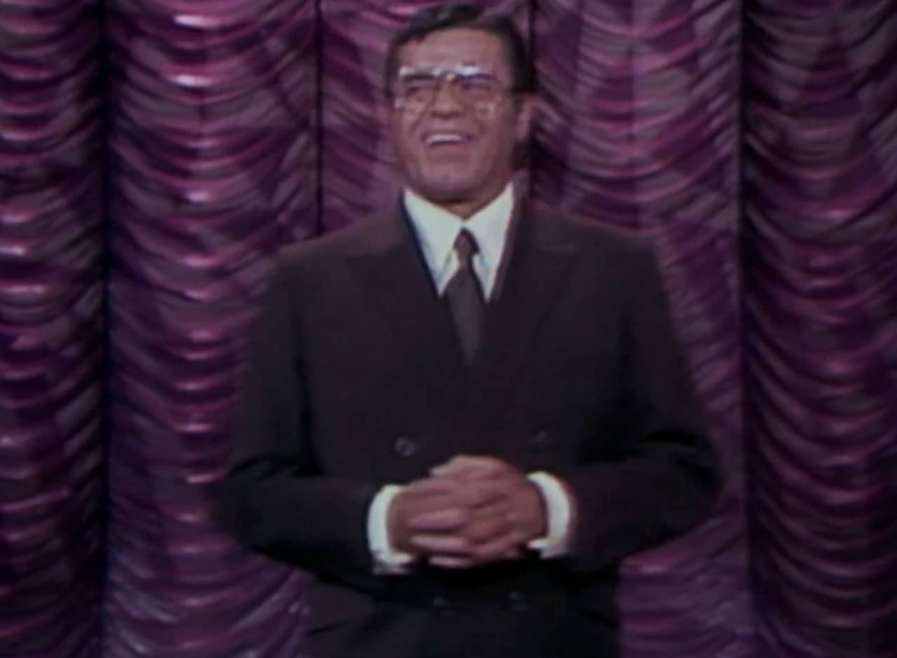Jerry Langford in front of a purple curtain