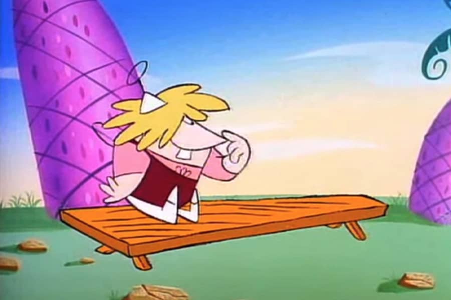 young blonde boy sitting on a bench