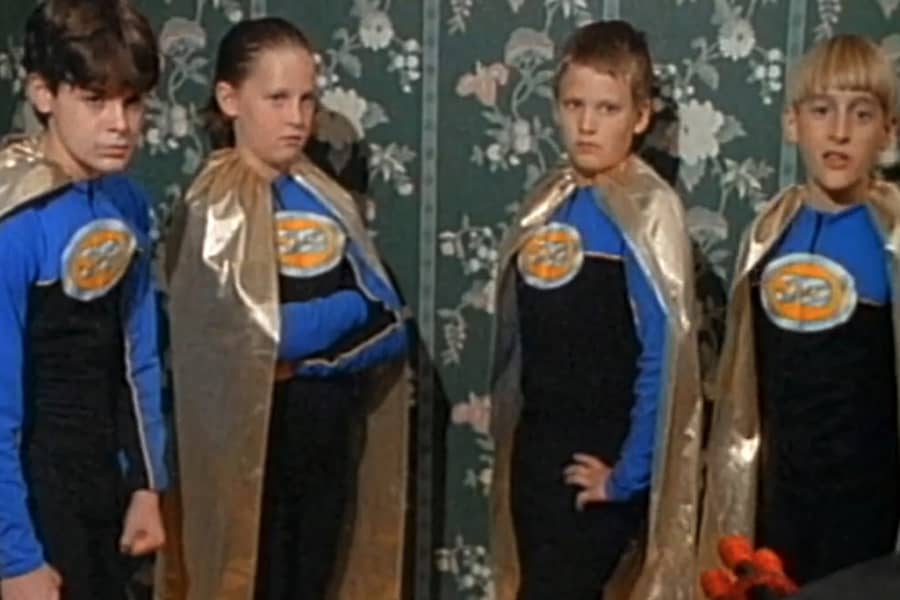 The Junior Defenders in matching blue costumes