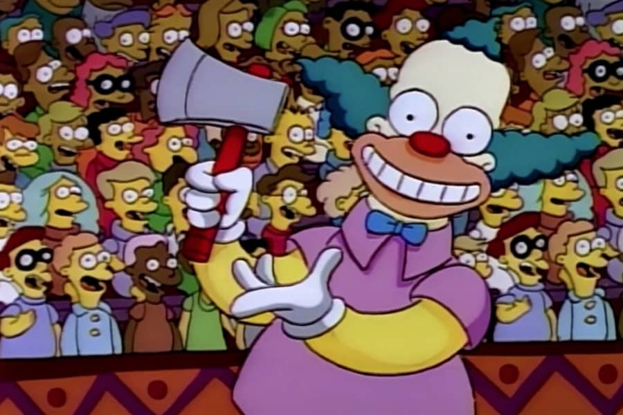 Krusty smiling wide and holding an axe