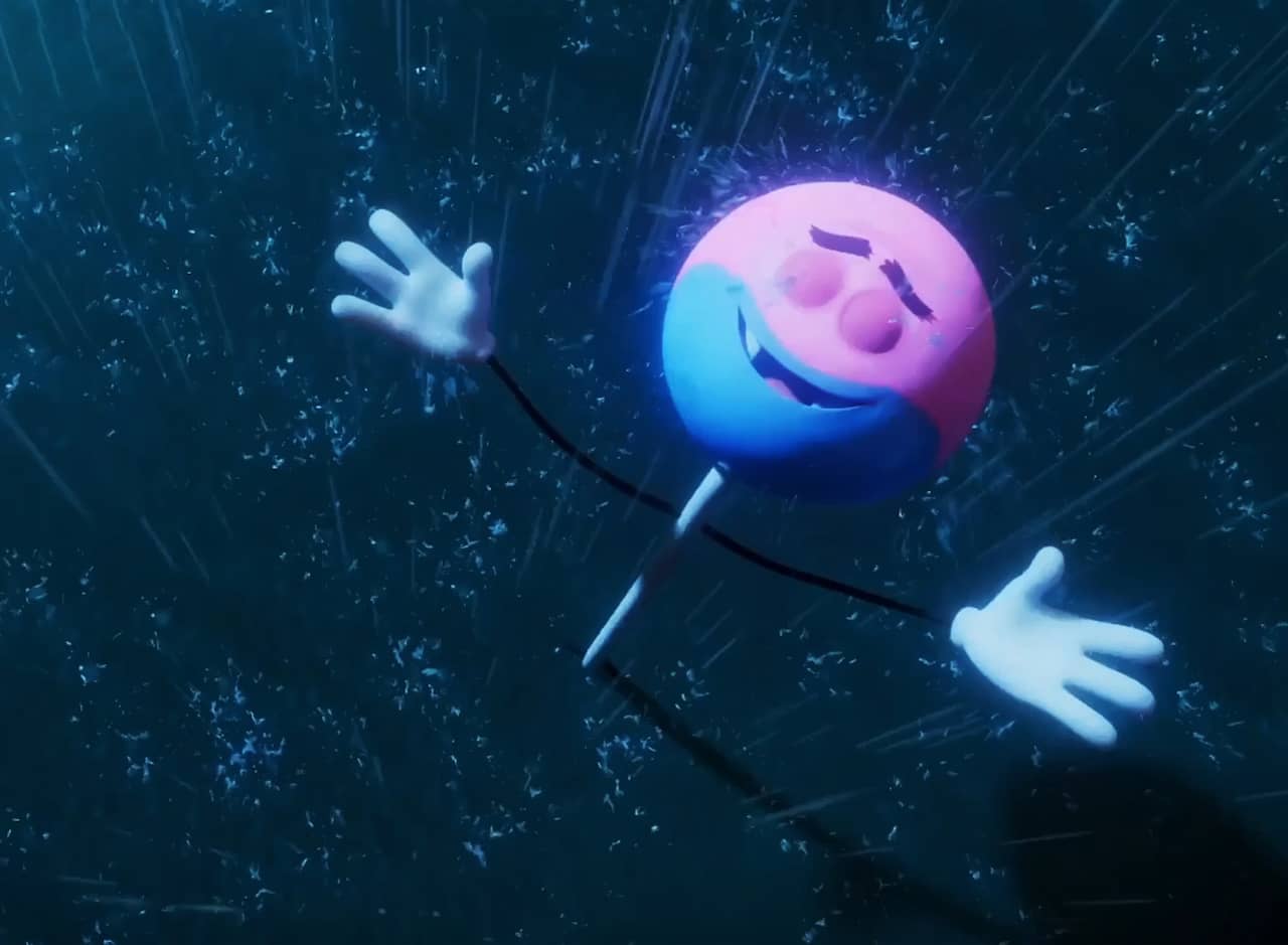 Candy Dufresne, a lollipop, standing triumphant with his arms raised in the rain