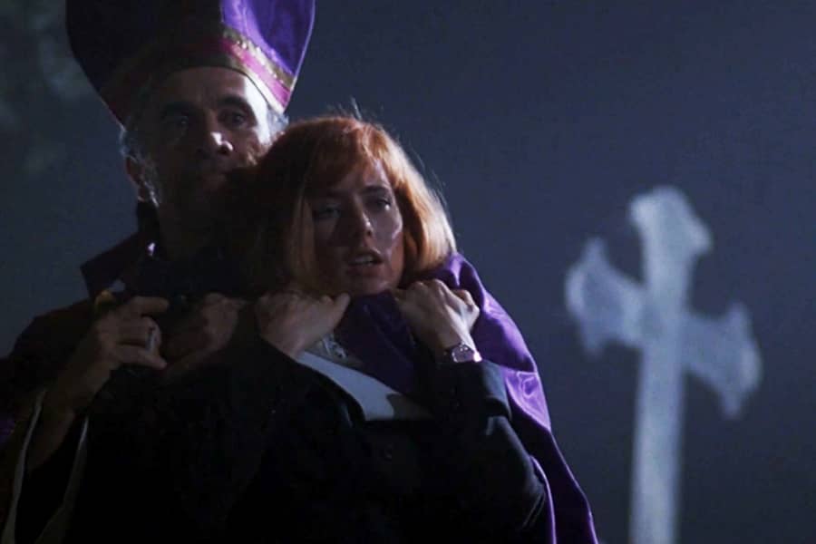 the pope holding a gun up to Scully