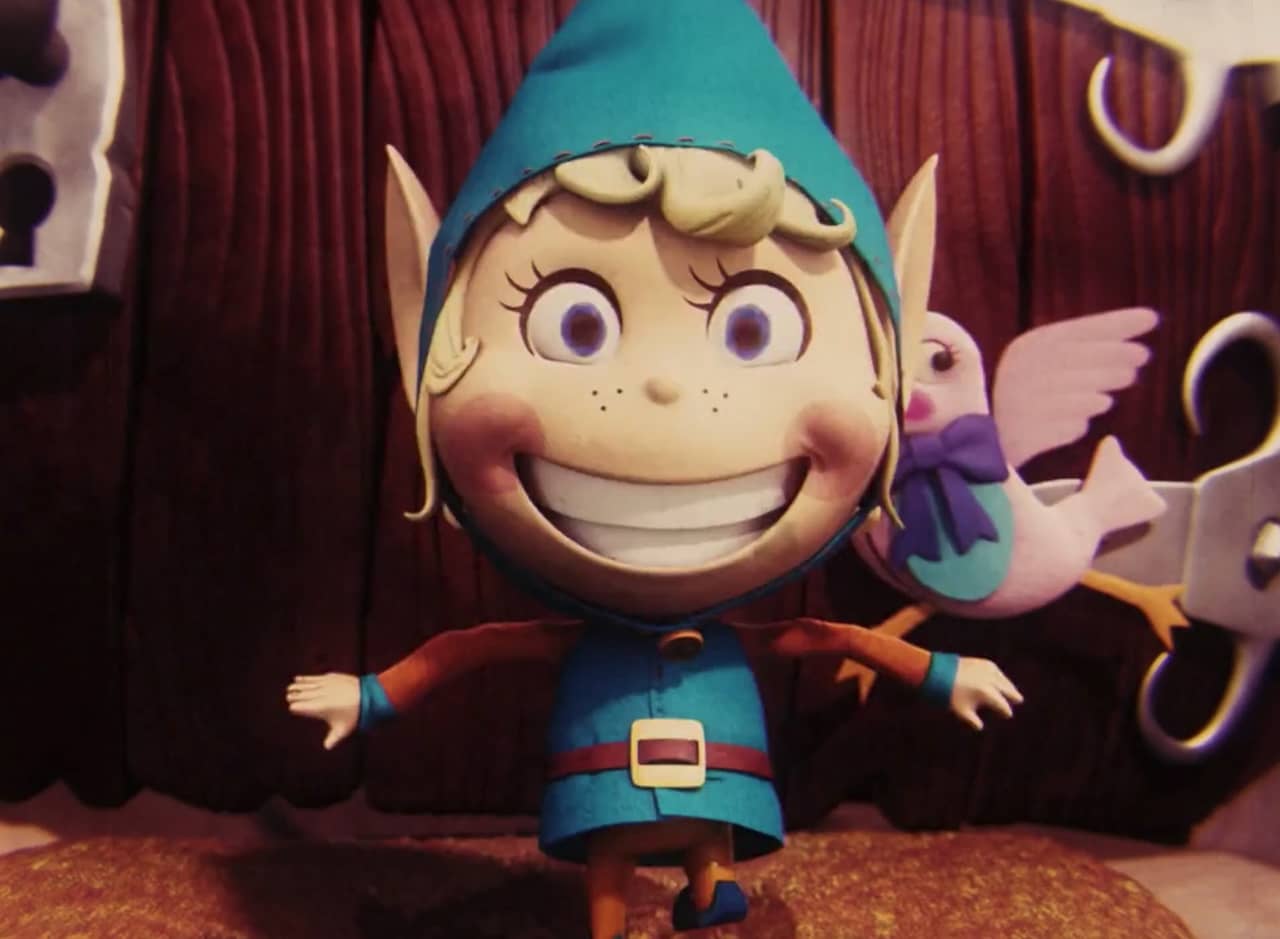 a CGI elf smiles big