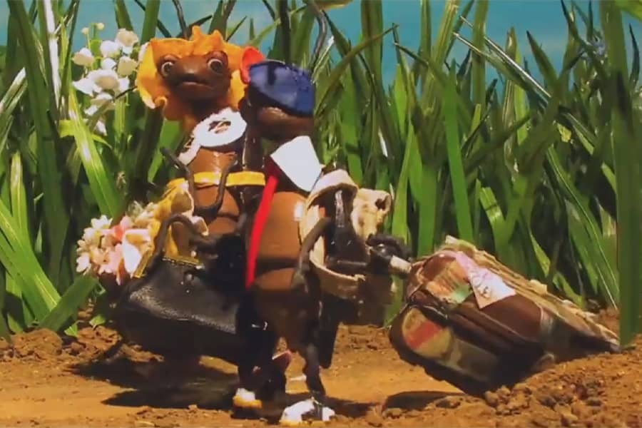 little roach with his mother, draggins suitcases through the grass