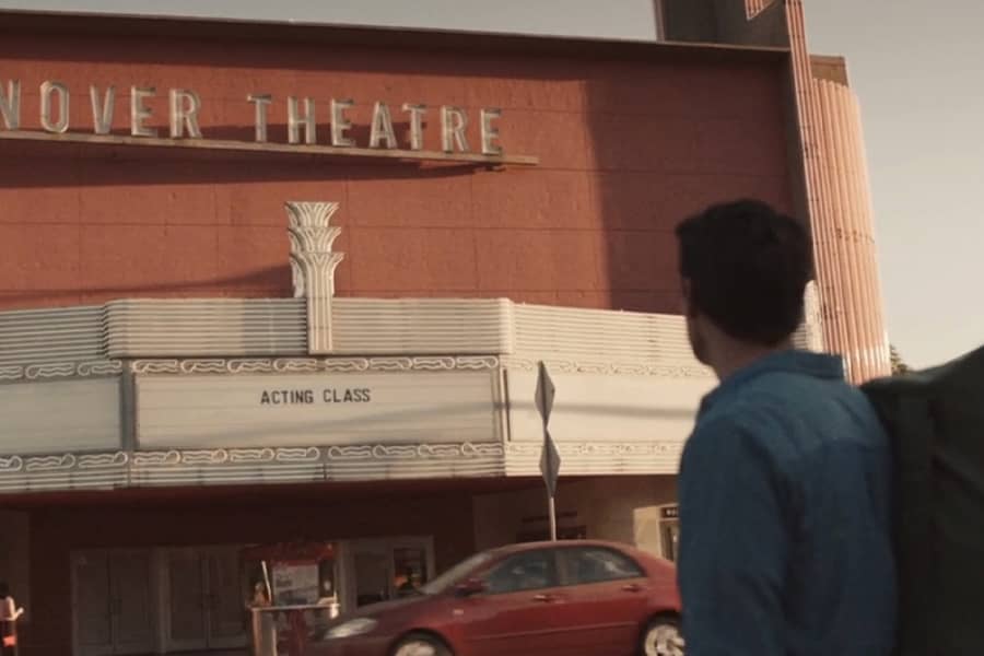 Barry looks at the theater from the street