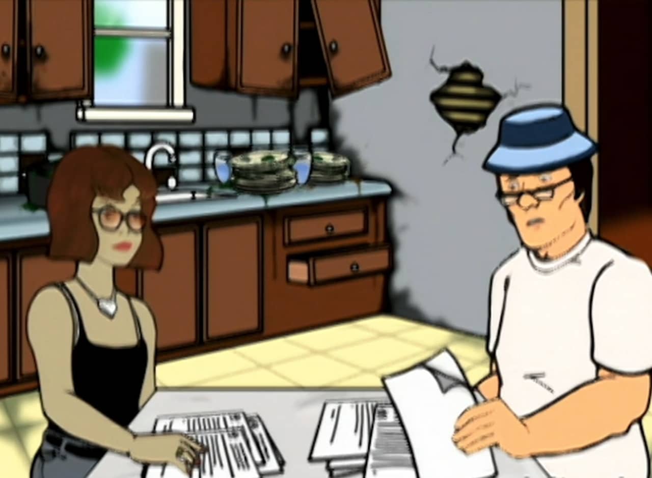 The Mckendricks sitting at the table doing paperwork