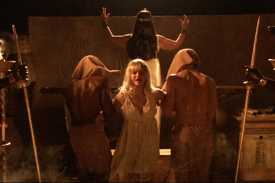 blonde woman being taken prisoner