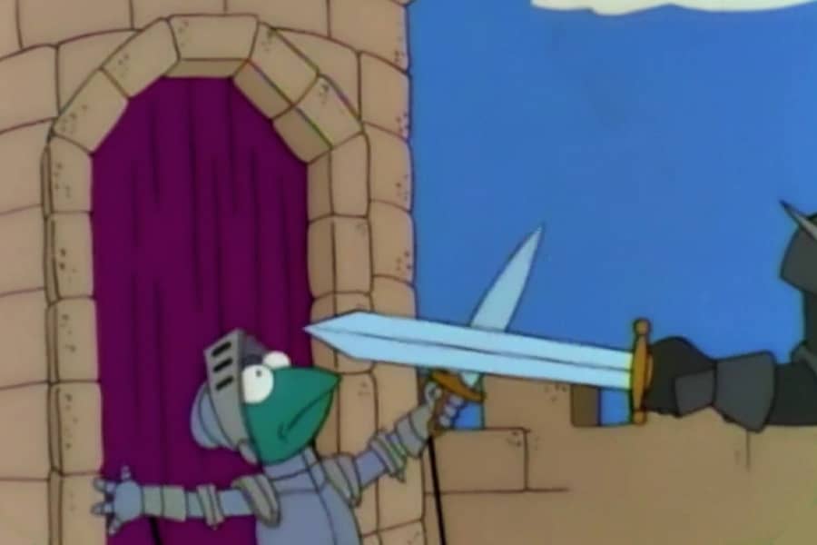 a sword swings toward Kermit