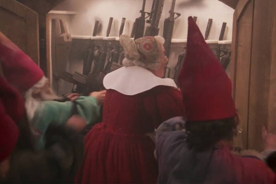Mrs. Claus and the elves grab guns off the wall