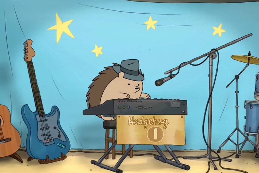 Hedgehog wearing a hat and playing a keyboard