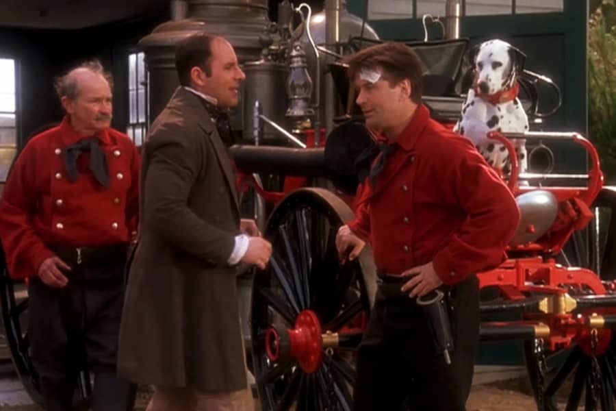 Barrenger with another man next to a firehouse