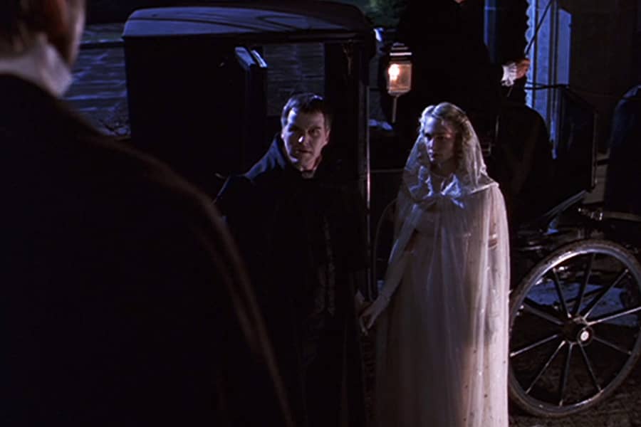 Count Krelski arrives with Maria in horse carriage as Victor stands on the steps of his castle