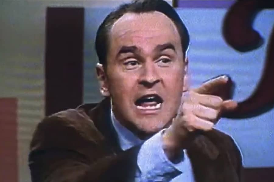 another male guest angrily pointing