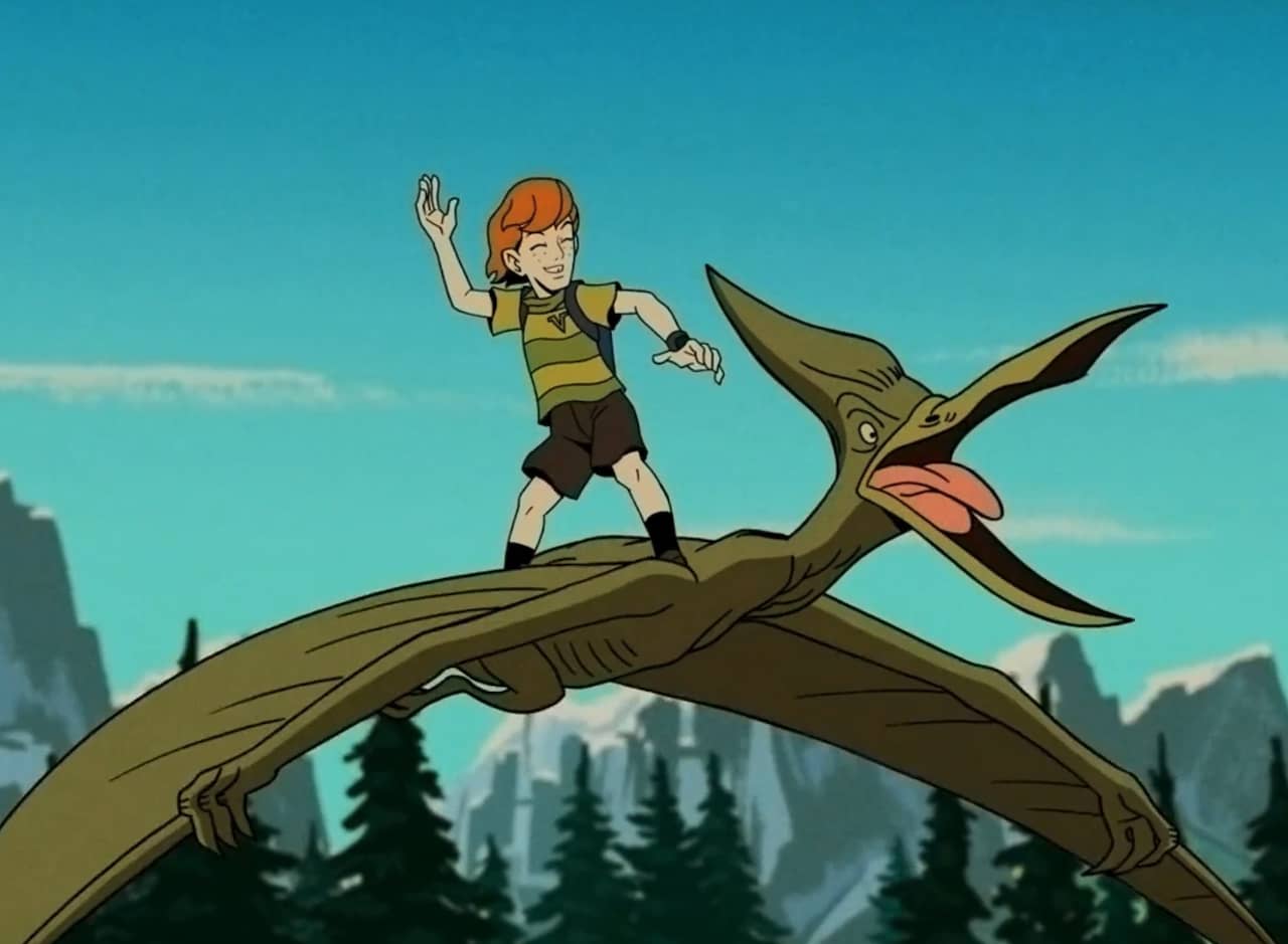 Rusty Venture, a young red-haired boy, standing on the back of a pterodactyl