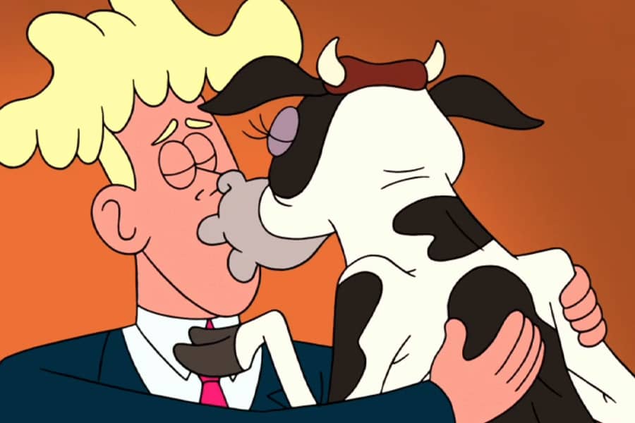 man and cow smooching