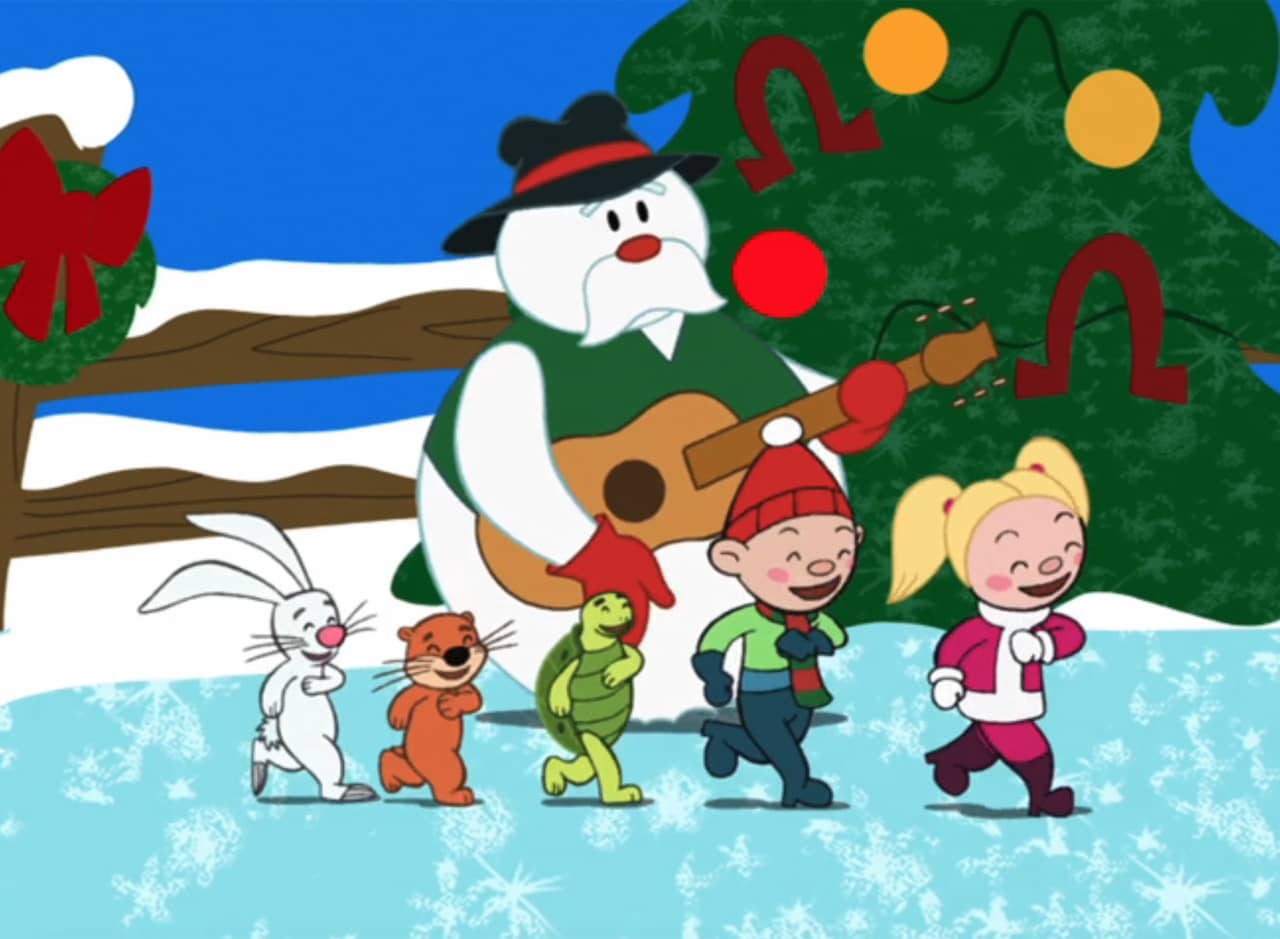 Snowman Hank, a snowman playing a guitar, surrounded by dancing kids and animals