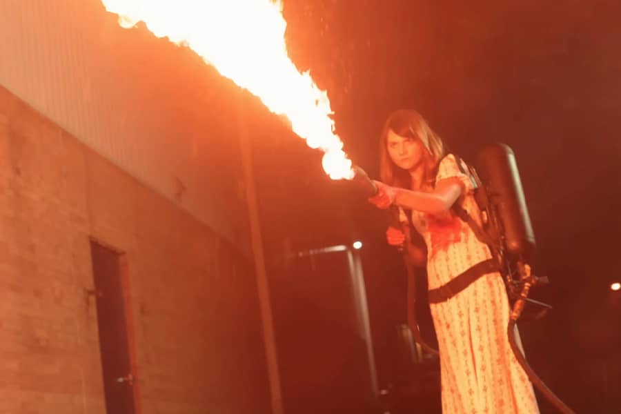 Amanda holding a flame thrower