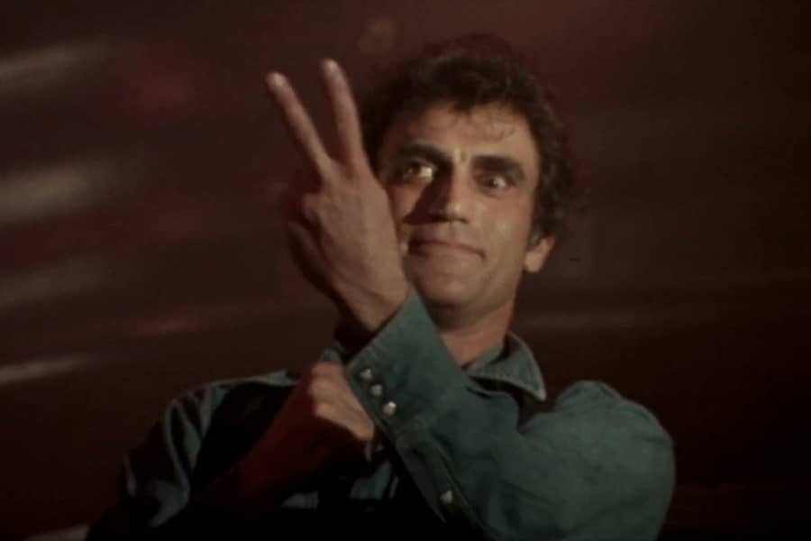 Newman holding up two fingers