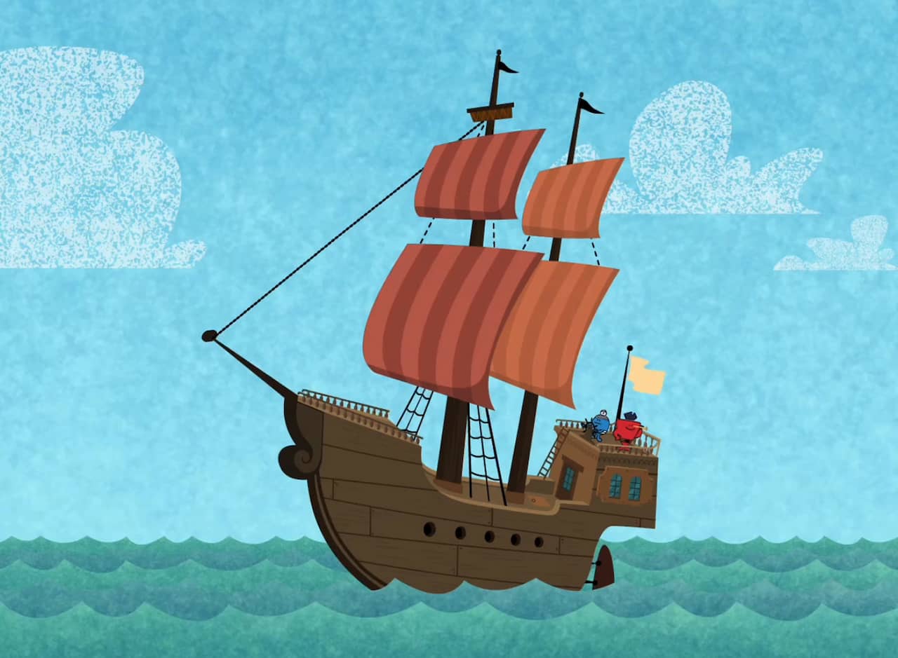 a ship with big sails on the ocean