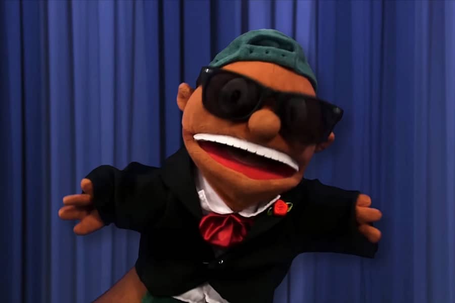 puppet with backwards hat and sunglasses