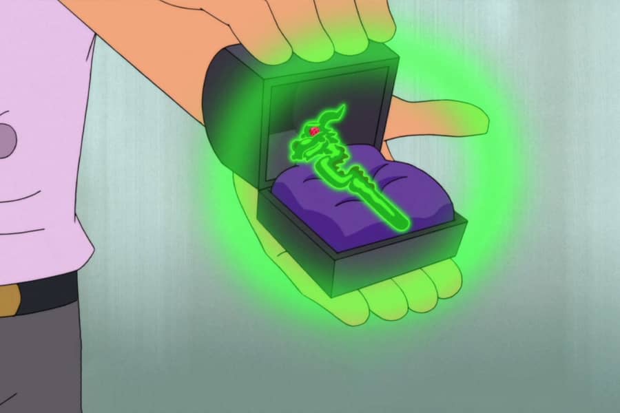 the man opens a jewelry box to reveal a glowing jade hairpin
