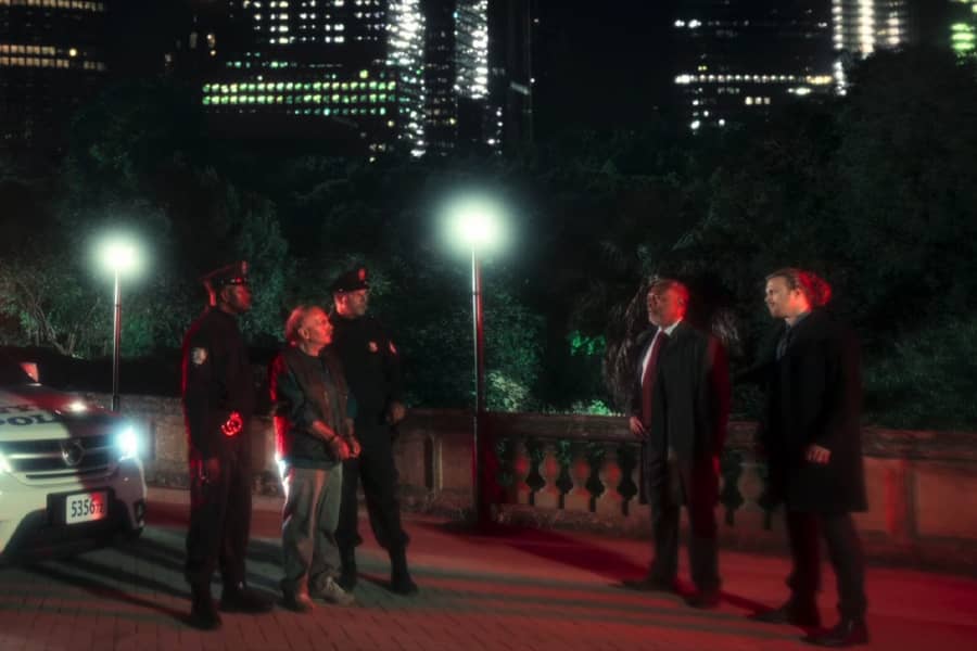 Inspector Jackson and Sam with cops who have a suspect in custody