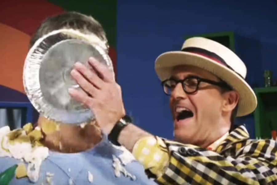 Uncle Howee smashing a pie in another man’s face