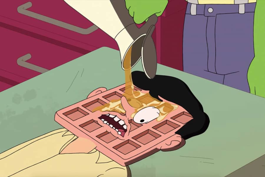 the Waffler pouring syrup on the guy’s face