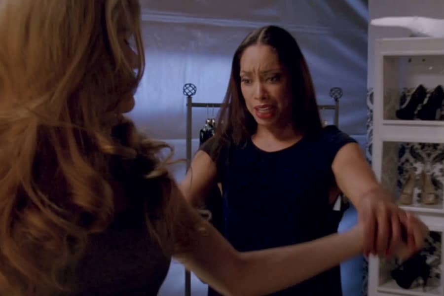 Penelope looking at a model’s outfit