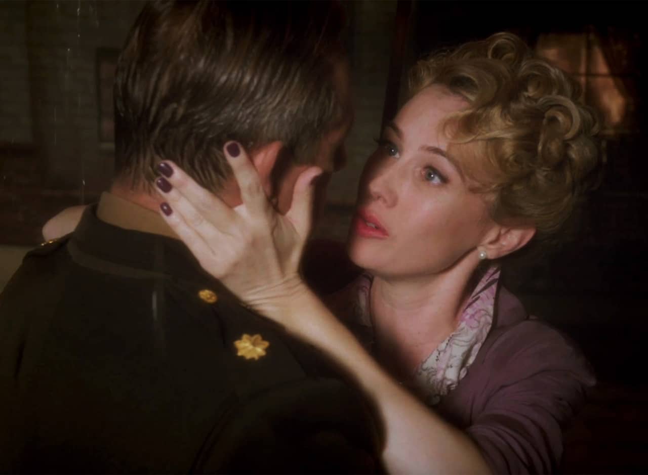 Whitney Frost speaks to her character’s lover, a soldier whose face she holds in her hands