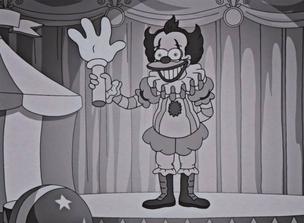 Krusto the Clown holding up a big fake hand